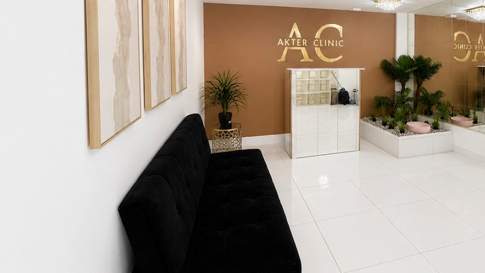 Akter Clinic reception with branded wall and seating