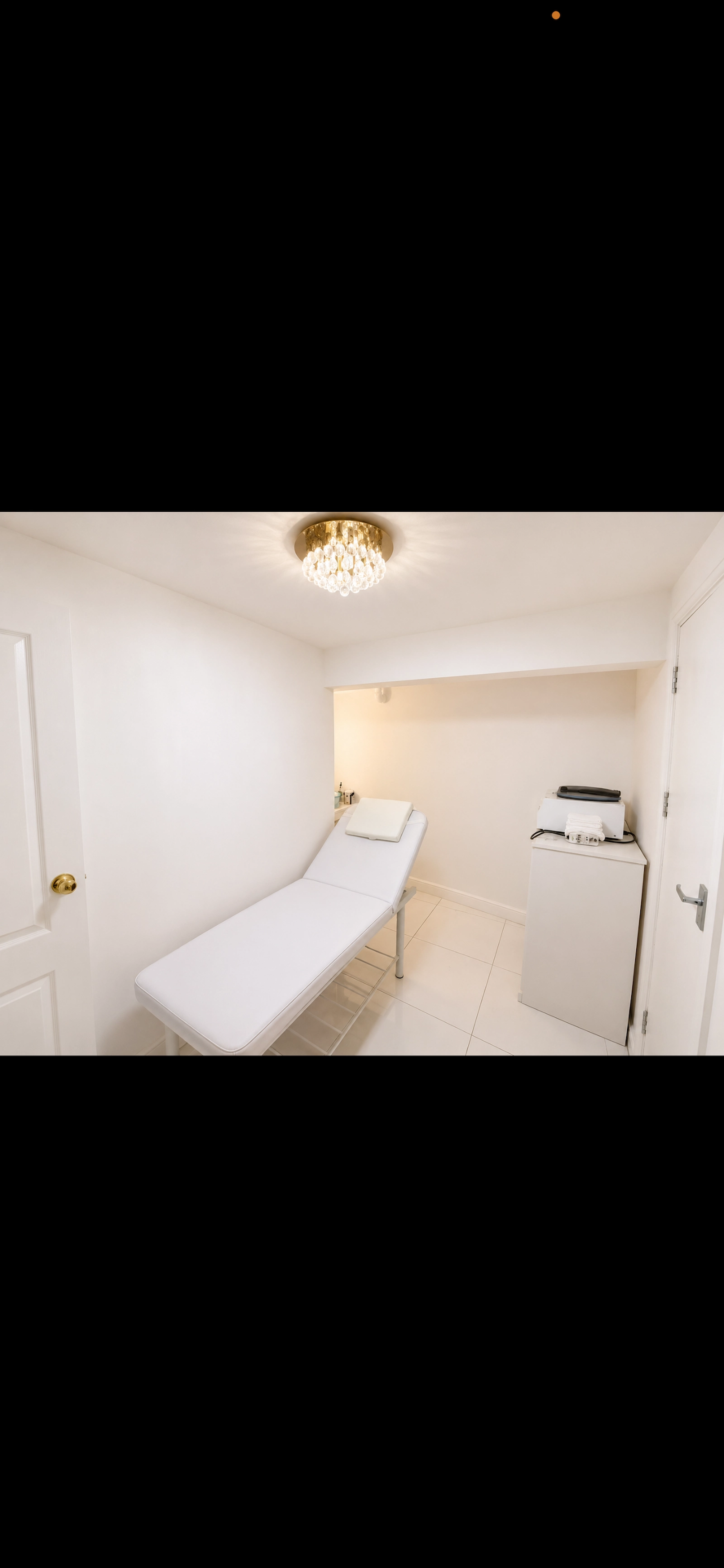 Akter Clinic private treatment room with treatment bed and equipment
